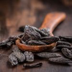 Fragrant tonka beans for baking and cooking on dark background
